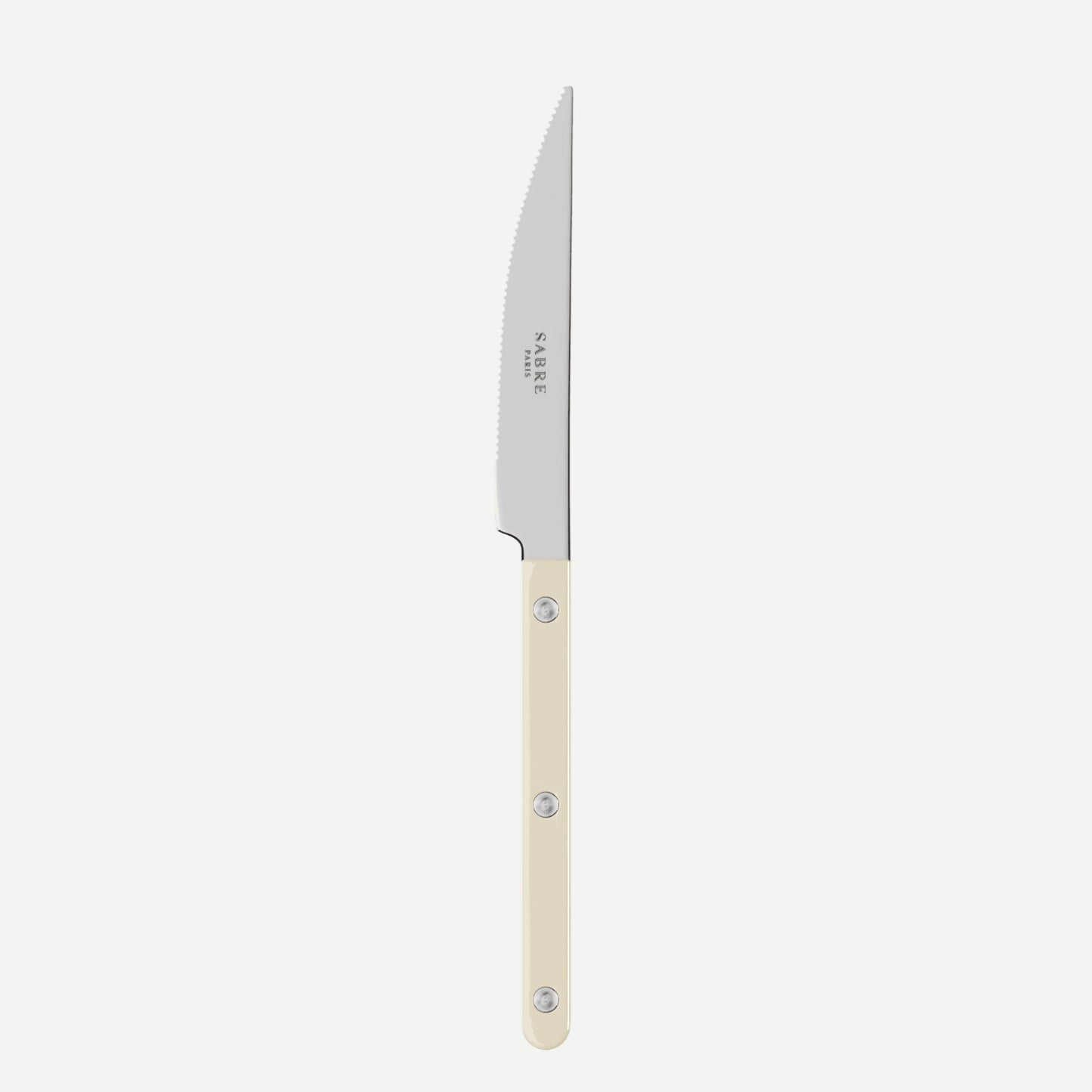 Knife with a white handle on a light beige background