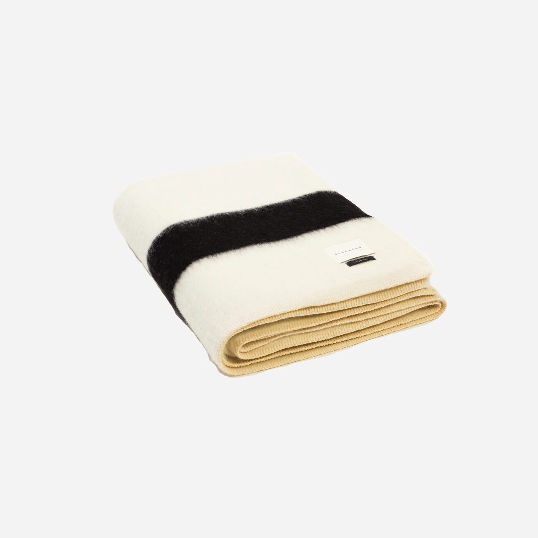 THE SIEMPRE RECYLCED BLANKET - IVORY WITH BLACK STRIPE