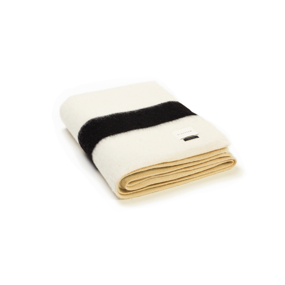 THE SIEMPRE RECYLCED BLANKET - IVORY WITH BLACK STRIPE