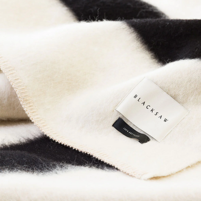 THE SIEMPRE RECYLCED BLANKET - IVORY WITH BLACK STRIPE